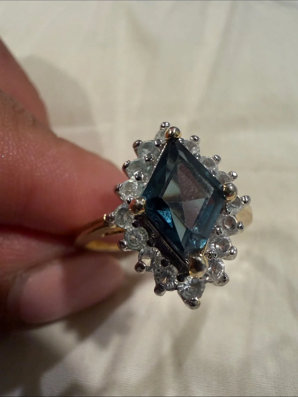 18K Gold Electroplated Ring with Deep Blue Kite-Cut Center and Clear Stones.
